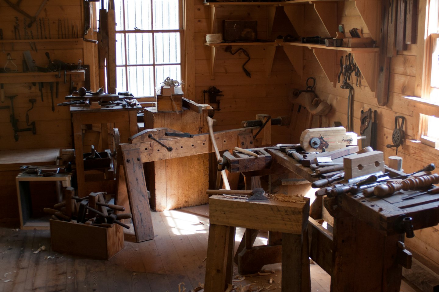 Vintage woodworking tools displayed in a traditional workshop.